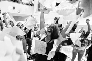 Alton Strupp | The Republic Columbus East High School seniors throw papers in to the air Thursday during the school's annual last day of high school ritual unofficially marking their rite of passage to becoming graduates.