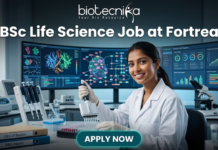 Urgent Hiring! BSc Life Science Job at Fortrea | Opportunity You Shouldn’t Miss BSc Life Science Job at Fortrea Opportunity You Shouldn’t Miss. A promotional featured image for a job page. At the top, text reads: "biotecnika Your Bio Resource" and the headline "BSc Life Science Job at Fortrea". The image depicts a smiling female scientist of Indian heritage, in a white lab coat and nitrile gloves, using a multichannel pipette to work with a 96-well plate at a modern laboratory bench. The background features three large, curved monitors displaying complex data visualizations like protein structures, molecular pathways, and generic clinical trial progress charts. Foreground elements include binders labeled "Clinical Studies" and "R&D reports", microcentrifuge tubes, and multiple pipettes. At the bottom center is a teal "APPLY NOW" button.