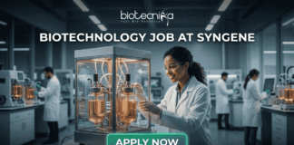 Biotechnology Job at Syngene Bangalore. A minimalist black text-based logo on a plain white background, featuring the primary word "biotecnika" in a modern, lower-case sans-serif font. Below the main name, the tagline "Your Bio Resource" is in a smaller, spaced-out serif font. Integrated into the right side of the "biotecnika" text is a stylized, single-line glyph of an abstract human figure with an outstretched arm.