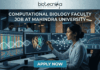 Computational Biology Faculty Job at Mahindra University. A professional featured image for a computational biology faculty job opening at Mahindra University, created for Biotecnika. The scene depicts a female academic or researcher in a modern, high-tech lab or data center, interacting with multiple large monitors. The screens display complex genomic sequences, a vibrant 3D protein structure, and analytical graphs. The Biotecnika logo is positioned at the top center, the bold text "COMPUTATIONAL BIOLOGY FACULTY JOB AT MAHINDRA UNIVERSITY" is featured prominently, and a teal "APPLY NOW" button is at the bottom.