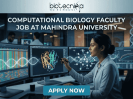 Computational Biology Faculty Job at Mahindra University. A professional featured image for a computational biology faculty job opening at Mahindra University, created for Biotecnika. The scene depicts a female academic or researcher in a modern, high-tech lab or data center, interacting with multiple large monitors. The screens display complex genomic sequences, a vibrant 3D protein structure, and analytical graphs. The Biotecnika logo is positioned at the top center, the bold text "COMPUTATIONAL BIOLOGY FACULTY JOB AT MAHINDRA UNIVERSITY" is featured prominently, and a teal "APPLY NOW" button is at the bottom.