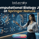 Computational Biology Job at Springer Nature – Build Your Science Communication Career Today!! Computational Biology Job at Springer Nature – Build Your Science Communication Career Today!! Biotecnika corporate logo and tagline: "Your Bio Resource". The logo features the text "biotecnika" in a modern, black, bold sans-serif font. Below it, in a smaller, thinner font, is the text "Your Bio Resource". To the right of the brand name, there is a stylized, elegant black icon of a dynamic, leaping human figure formed by flowing curved lines, with a simple dot for a head. All elements are in black against a white background.