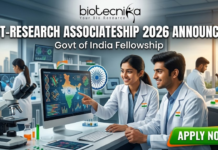 DBT-Research Associateship 2026 Announced – Govt of India Fellowship for Life Science Researchers! DBT-Research Associateship 2026 Govt of India Fellowship. A promotional featured image for the "DBT-Research Associateship 2026" Government of India Fellowship. The graphic shows two scientists in white lab coats working in a high-tech laboratory, looking at a computer screen displaying scientific data and a map of India. The Biotecnika logo is at the top, with the announcement text in the center and a prominent "APPLY NOW" button at the bottom right.
