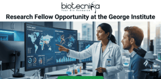 Research Fellow at George Institute | Fresher's Job India. A professional featured job image with the Biotecnika logo at the top and a bold headline reading "Research Fellow Opportunity at the George Institute." The central scene features a female scientist in a white lab coat pointing to a large digital monitor displaying global health maps, data analytics, and chronic disease trends, while a male colleague looks on. The setting is a modern, high-tech laboratory equipped with a microscope and glassware. At the bottom center, there is a prominent green "APPLY NOW" button.