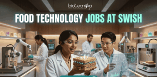 Exciting Food Technology Jobs Alert at Swish | Don't Miss This Opporunity. A unique and futuristic featured image for "Food Technology Jobs at Swish." Two scientists in a high-tech food lab are examining a glowing, layered "tech-food" sample. The lab is equipped with 3D food printers and robotic arms. The Biotecnika logo is at the top, and a clean "Apply Now" button with an arrow is at the bottom center.