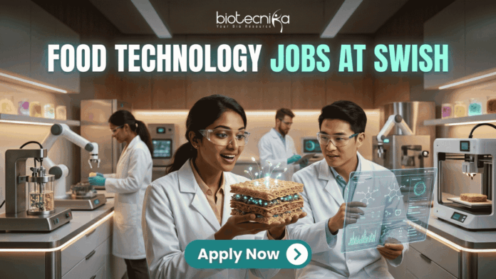 Exciting Food Technology Jobs Alert at Swish Don't Miss This Opporunity Exciting Food Technology Jobs Alert at Swish | Don't Miss This Opporunity. A unique and futuristic featured image for "Food Technology Jobs at Swish." Two scientists in a high-tech food lab are examining a glowing, layered "tech-food" sample. The lab is equipped with 3D food printers and robotic arms. The Biotecnika logo is at the top, and a clean "Apply Now" button with an arrow is at the bottom center.