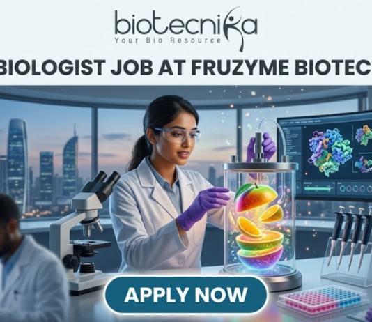 Fruzyme Biotech India Hiring Microbiologist Job | Freshers Eligible Apply Now! Microbiologist Job at Fruzyme Biotech India | Freshers Eligible. A professional and vibrant featured image for a "Microbiologist Job at Fruzyme Biotech India." The image depicts a female scientist in a high-tech lab working with a unique bioreactor containing glowing, levitating fruit slices, symbolizing specialized enzyme research. Modern lab equipment, data-filled monitors showing "Fruit Polysaccharide Enzyme Pathways," and a city skyline are visible in the background. The Biotecnika logo is positioned at the top center, the main title is in bold black text, and a prominent "APPLY NOW" button is at the bottom.