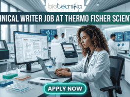 Technical Writer Job at Thermo Fisher Scientific | Life Science Job. Featured image for a Technical Writer job vacancy at Thermo Fisher Scientific. The realistic visual features a professional female scientist in a white lab coat and safety glasses diligently working on a laptop within a high-tech, modern laboratory filled with advanced scientific equipment and monitors. The top of the image displays the Biotecnika logo and the bold text 'TECHNICAL WRITER JOB AT THERMO FISHER SCIENTIFIC,' while a prominent, glowing 'APPLY NOW' button is positioned at the bottom center.
