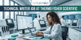 Technical Writer Job at Thermo Fisher Scientific | Latest Life Science Job Opportunities Technical Writer Job at Thermo Fisher Scientific | Life Science Job. Featured image for a Technical Writer job vacancy at Thermo Fisher Scientific. The realistic visual features a professional female scientist in a white lab coat and safety glasses diligently working on a laptop within a high-tech, modern laboratory filled with advanced scientific equipment and monitors. The top of the image displays the Biotecnika logo and the bold text 'TECHNICAL WRITER JOB AT THERMO FISHER SCIENTIFIC,' while a prominent, glowing 'APPLY NOW' button is positioned at the bottom center.