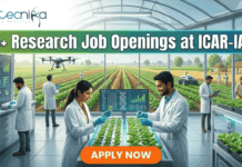 25+ Research Job Openings at ICAR-IARI | Online Interview for Agriculture Graduates! 25+ Research Job Openings at ICAR-IARI – Online Interview . A featured image for a job advertisement titled "25+ Research Job Openings at ICAR-IARI." The image depicts a futuristic, high-tech agricultural laboratory set within a large glass greenhouse. In the foreground, a female and a male scientist in white lab coats are working at a digital station, examining young green plants. Digital screens display DNA sequences and plant growth data. In the background, a drone flies over rows of crops, and through the glass walls, traditional farmers are seen working in lush green fields. The Biotecnika logo is at the top left, and a prominent orange "APPLY NOW" button is centered at the bottom.