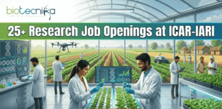 25+ Research Job Openings at ICAR-IARI | Online Interview for Agriculture Graduates! 25+ Research Job Openings at ICAR-IARI – Online Interview . A featured image for a job advertisement titled "25+ Research Job Openings at ICAR-IARI." The image depicts a futuristic, high-tech agricultural laboratory set within a large glass greenhouse. In the foreground, a female and a male scientist in white lab coats are working at a digital station, examining young green plants. Digital screens display DNA sequences and plant growth data. In the background, a drone flies over rows of crops, and through the glass walls, traditional farmers are seen working in lush green fields. The Biotecnika logo is at the top left, and a prominent orange "APPLY NOW" button is centered at the bottom.