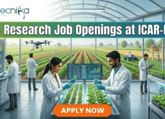 25+ Research Job Openings at ICAR-IARI | Online Interview for Agriculture Graduates! 25+ Research Job Openings at ICAR-IARI – Online Interview . A featured image for a job advertisement titled "25+ Research Job Openings at ICAR-IARI." The image depicts a futuristic, high-tech agricultural laboratory set within a large glass greenhouse. In the foreground, a female and a male scientist in white lab coats are working at a digital station, examining young green plants. Digital screens display DNA sequences and plant growth data. In the background, a drone flies over rows of crops, and through the glass walls, traditional farmers are seen working in lush green fields. The Biotecnika logo is at the top left, and a prominent orange "APPLY NOW" button is centered at the bottom.