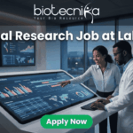 Clinical Research Job at Labcorp Bangalore | Apply Now! A realistic and attention-grabbing featured image, size 1280x720, designed for a job page. It features two black clinical researchers, a woman pointing and a man in a white lab coat, collaborating intensely at a massive, tilted touch-screen interface within a futuristic laboratory setting. The screen displays complex multi-colored data visualizations, timelines, maps, and charts with text labeling "Clinical Trial Data Analysis". Prominent white text at the top states: "Clinical Research Job at Labcorp". The complete Biotecnika logo (including text and tagline 'Your Bio Resource') is at the top-center. A distinct vibrant green "Apply Now" button is clearly positioned at the bottom-center.