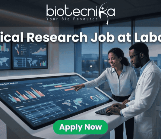 Clinical Research Job at Labcorp Bangalore | Apply Now! A realistic and attention-grabbing featured image, size 1280x720, designed for a job page. It features two black clinical researchers, a woman pointing and a man in a white lab coat, collaborating intensely at a massive, tilted touch-screen interface within a futuristic laboratory setting. The screen displays complex multi-colored data visualizations, timelines, maps, and charts with text labeling "Clinical Trial Data Analysis". Prominent white text at the top states: "Clinical Research Job at Labcorp". The complete Biotecnika logo (including text and tagline 'Your Bio Resource') is at the top-center. A distinct vibrant green "Apply Now" button is clearly positioned at the bottom-center.