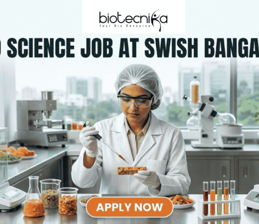 Food Science Job at Swish Bangalore. A clean, modern featured image showing a food scientist in a sterile lab environment using a precision pipette on a nutrient-rich food prototype. The lab is equipped with advanced food testing machinery and colorful test tubes. The city skyline of Bangalore is visible through the window. The Biotecnika logo is at the top, and an orange "Apply Now" button is at the bottom.
