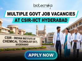 Multiple Govt Job Vacancies at CSIR-IICT Hyderabad | Walk-in-Interview for Life Science Candidates. A realistic featured image for "Multiple Govt Job Vacancies at CSIR-IICT Hyderabad." It depicts scientists walking in front of the CSIR-Indian Institute of Chemical Technology entrance, with the iconic Charminar visible in the background under a clear blue sky. The Biotecnika logo is at the top, and a prominent blue "APPLY NOW" button is at the bottom.