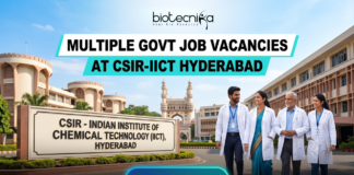 Multiple Govt Job Vacancies at CSIR-IICT Hyderabad | Walk-in-Interview for Life Science Candidates. A realistic featured image for "Multiple Govt Job Vacancies at CSIR-IICT Hyderabad." It depicts scientists walking in front of the CSIR-Indian Institute of Chemical Technology entrance, with the iconic Charminar visible in the background under a clear blue sky. The Biotecnika logo is at the top, and a prominent blue "APPLY NOW" button is at the bottom.