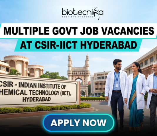 Multiple Govt Job Vacancies at CSIR-IICT Hyderabad | Walk-in-Interview for Life Science Candidates. A realistic featured image for "Multiple Govt Job Vacancies at CSIR-IICT Hyderabad." It depicts scientists walking in front of the CSIR-Indian Institute of Chemical Technology entrance, with the iconic Charminar visible in the background under a clear blue sky. The Biotecnika logo is at the top, and a prominent blue "APPLY NOW" button is at the bottom.