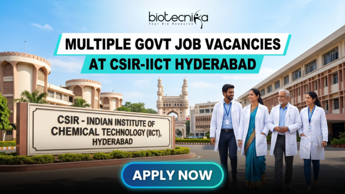 Multiple Govt Job Vacancies at CSIR-IICT Hyderabad | Walk-in-Interview for Life Science Candidates. A realistic featured image for "Multiple Govt Job Vacancies at CSIR-IICT Hyderabad." It depicts scientists walking in front of the CSIR-Indian Institute of Chemical Technology entrance, with the iconic Charminar visible in the background under a clear blue sky. The Biotecnika logo is at the top, and a prominent blue "APPLY NOW" button is at the bottom.