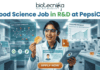 Food Science Job in R&D at PepsiCo – Freshers Can Apply Now! Food Science Job in R&D at PepsiCo – Freshers Can Apply Now! A promotional image featuring the 'biotecnika Your Bio Resource' logo at the top and the large headline 'Computational Biology Job at Springer Nature'. The central figure is a professional woman of South Asian descent, in a white shirt and dark trousers, pointing enthusiastically at a large, glowing interactive wall display. The display presents various complex scientific visualizations, including colorful gene interaction networks, detailed protein structures, a large and beautiful stylized phylogenetic tree, and key research insights with a donut chart. In the blurred background, other professionals work in a high-tech, futuristic office with glowing screens. A prominent, multi-colored button at the bottom center reads 'APPLY NOW'. The overall scene is high-tech, scientific, and inviting.