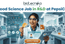 Food Science Job in R&D at PepsiCo – Freshers Can Apply Now! Food Science Job in R&D at PepsiCo – Freshers Can Apply Now! A promotional image featuring the 'biotecnika Your Bio Resource' logo at the top and the large headline 'Computational Biology Job at Springer Nature'. The central figure is a professional woman of South Asian descent, in a white shirt and dark trousers, pointing enthusiastically at a large, glowing interactive wall display. The display presents various complex scientific visualizations, including colorful gene interaction networks, detailed protein structures, a large and beautiful stylized phylogenetic tree, and key research insights with a donut chart. In the blurred background, other professionals work in a high-tech, futuristic office with glowing screens. A prominent, multi-colored button at the bottom center reads 'APPLY NOW'. The overall scene is high-tech, scientific, and inviting.