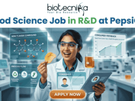 Food Science Job in R&D at PepsiCo – Freshers Can Apply Now! Food Science Job in R&D at PepsiCo – Freshers Can Apply Now! A promotional image featuring the 'biotecnika Your Bio Resource' logo at the top and the large headline 'Computational Biology Job at Springer Nature'. The central figure is a professional woman of South Asian descent, in a white shirt and dark trousers, pointing enthusiastically at a large, glowing interactive wall display. The display presents various complex scientific visualizations, including colorful gene interaction networks, detailed protein structures, a large and beautiful stylized phylogenetic tree, and key research insights with a donut chart. In the blurred background, other professionals work in a high-tech, futuristic office with glowing screens. A prominent, multi-colored button at the bottom center reads 'APPLY NOW'. The overall scene is high-tech, scientific, and inviting.