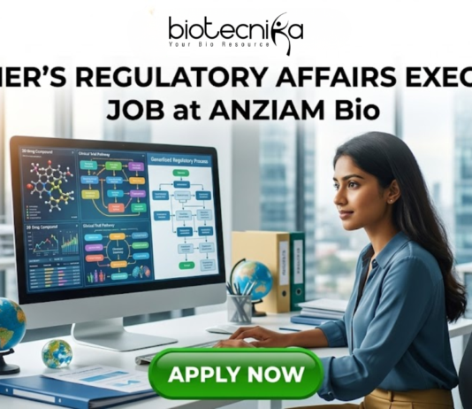 Fresher Regulatory Affairs Executive Job at ANZIAM Bio Apply. A recruitment poster for a "Fresher’s Regulatory Affairs Executive Job at ANZIAM Bio," featuring a young professional woman concentrating on a large computer monitor in a modern open-plan office with a cityscape view through the windows. The logo "biotecnika Global tagling technolgies" is at the top. On her desk, colorful files with labels like "Global Reg Guidelines," "EU Submission," and "ANZ Submission Protocols" are stacked, along with two globes. The computer screen shows regulatory pathways and charts. At the bottom center, a prominent green button reads "APPLY NOW".