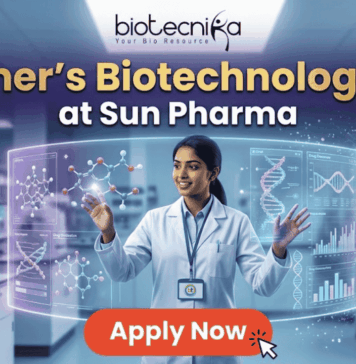Fresher’s Job Alert! Biotechnology Job at Sun Pharma | Don’t Miss Out! Fresher's Job Alert! Biotechnology Job at Sun Pharma Don’t Miss Out! A promotional job banner with the Biotecnika logo at the top. The headline text is "Fresher's Biotechnology Job" and "at Sun Pharma". A smiling young woman in a lab coat stands in a futuristic laboratory, interacting with floating holographic screens. The screens display molecular structures labeled "Drug Discovery" and "Lead Identification," and a DNA helix with graphs labeled "DNA" and "Data Discovery". A large red button at the bottom says "Apply Now". The background shows complex lab equipment.