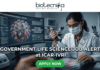 Government Life Science Job Alert 2026 – Earn Upto ₹56,000 + HRA as Research Scientist at ICAR-IVRI!. Professional featured image for a "Government Life Science Job Alert at ICAR-IVRI" advertisement. The image depicts a female scientist in a white lab coat and protective gear using a pipette in a high-tech laboratory setting. A large computer monitor in the background displays detailed 3D pathogen genomics and vaccine development data. The layout features the Biotecnika logo at the top and a prominent green "APPLY NOW" button at the bottom center.