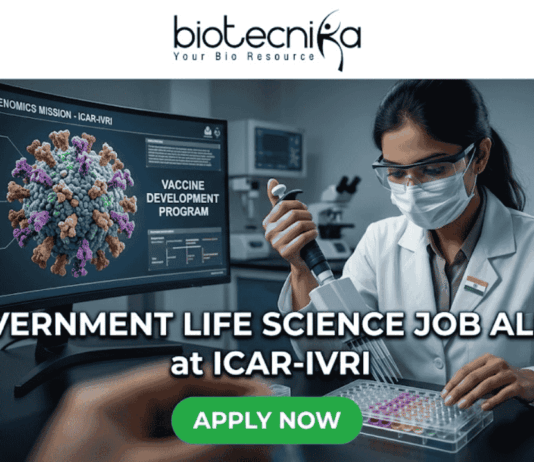 Government Life Science Job Alert 2026 – Earn Upto ₹56,000 + HRA as Research Scientist at ICAR-IVRI!. Professional featured image for a "Government Life Science Job Alert at ICAR-IVRI" advertisement. The image depicts a female scientist in a white lab coat and protective gear using a pipette in a high-tech laboratory setting. A large computer monitor in the background displays detailed 3D pathogen genomics and vaccine development data. The layout features the Biotecnika logo at the top and a prominent green "APPLY NOW" button at the bottom center.