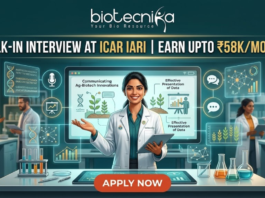 ICAR IARI Recruitment 2026: Walk-in Interview for Research Associate & SRF – Earn Upto ₹58,000/month ICAR IARI Recruitment Walk-in Interview - Earn Upto ₹58Kmonth. A featured job advertisement image for Biotecnika. At the top center, the Biotecnika logo with the text "biotecnika Your Bio Resource" is displayed. Below it, a main headline in gold and white text reads: "WALK-IN INTERVIEW AT ICAR IARI | EARN UPTO ₹58K/MONTH". A young female scientist of South Asian descent in a lab coat smiles and holds a tablet, presenting behind a futuristic desk with an advanced screen. Translucent blue holographic panels float around her, displaying graphs, a microphone icon, a DNA helix, and plant illustrations. Text on the panels includes "Communicating Ag-Biotech Innovations" and "Effective Presentation of Data". Other diverse scientists are working in the background laboratory environment. At the bottom center, a large red "APPLY NOW" button is prominent.