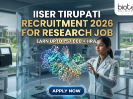 IISER Tirupati Recruitment for Research Job Earn Upto ₹57K. A high-tech, futuristic featured image for a research job recruitment at IISER Tirupati for 2026. The scene features a female researcher in a sleek, modern lab coat interacting with a glowing, holographic 3D protein model suspended in the air. The background showcases a state-of-the-art laboratory with advanced equipment and a view of the contemporary IISER Tirupati campus through large glass windows. The Biotecnika logo is positioned at the top right. The main heading "IISER TIRUPATI RECRUITMENT 2026 FOR RESEARCH JOB" is displayed in bold gold and white letters, accompanied by the tagline "EARN UPTO ₹57,000 + HRA." A prominent, glowing "APPLY NOW" button is located at the bottom center.