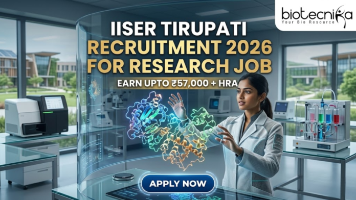 IISER Tirupati Recruitment for Research Job Earn Upto ₹57K IISER Tirupati Recruitment for Research Job Earn Upto ₹57K. A high-tech, futuristic featured image for a research job recruitment at IISER Tirupati for 2026. The scene features a female researcher in a sleek, modern lab coat interacting with a glowing, holographic 3D protein model suspended in the air. The background showcases a state-of-the-art laboratory with advanced equipment and a view of the contemporary IISER Tirupati campus through large glass windows. The Biotecnika logo is positioned at the top right. The main heading "IISER TIRUPATI RECRUITMENT 2026 FOR RESEARCH JOB" is displayed in bold gold and white letters, accompanied by the tagline "EARN UPTO ₹57,000 + HRA." A prominent, glowing "APPLY NOW" button is located at the bottom center.