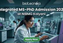 Integrated MS-PhD Admission 2026 at NIBMG Kalyani | Applications Invited! Integrated MS-PhD Admission 2026 at NIBMG Kalyani. A modern featured image for "Integrated MS-PhD Admission 2026 at NIBMG Kalyani." It shows a young scientist enthusiastically analyzing DNA sequencing data on a futuristic monitor in a genomics lab. Includes the Biotecnika logo and an "Apply Now" button.
