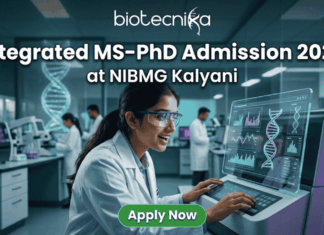 Integrated MS-PhD Admission 2026 at NIBMG Kalyani. A modern featured image for "Integrated MS-PhD Admission 2026 at NIBMG Kalyani." It shows a young scientist enthusiastically analyzing DNA sequencing data on a futuristic monitor in a genomics lab. Includes the Biotecnika logo and an "Apply Now" button.