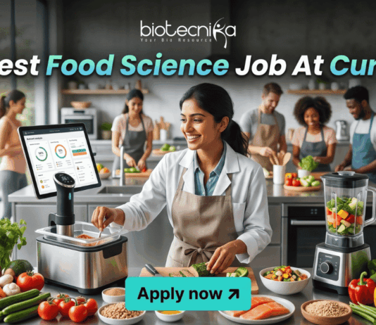 Latest Food Science Job At Curefit Apply For Nutritionist Role. A sleek, lifestyle-oriented featured image for "Latest Food Science Job At Curefit." It shows a food scientist in a modern culinary lab using smart kitchen technology like a sous-vide machine and a tablet dashboard. The Biotecnika logo is at the top, and a cyan "Apply now" button is at the bottom.
