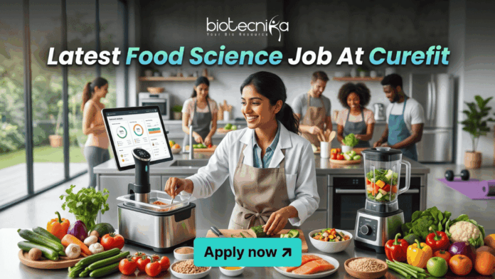 Latest Food Science Job At Curefit Apply For Nutritionist Role Latest Food Science Job At Curefit Apply For Nutritionist Role. A sleek, lifestyle-oriented featured image for "Latest Food Science Job At Curefit." It shows a food scientist in a modern culinary lab using smart kitchen technology like a sous-vide machine and a tablet dashboard. The Biotecnika logo is at the top, and a cyan "Apply now" button is at the bottom.