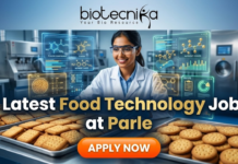 Latest Food Technology Job at Parle – BSc & BTech Graduates Apply Now! Latest Food Technology Job at Parle – BSc & BTech Graduates Apply Now. An advertisement featuring a smiling woman in a lab coat and safety glasses, working in a food production environment surrounded by futuristic holographic displays of "FLAVOR COMPOUNDS" and "NUTRIENT CHAINS." Large text reads "Latest Food Technology Job at Parle." At the top is the "biotecnika Your Bio Resource" logo, and a large "APPLY NOW" button is at the bottom. Trays of biscuits are on the counter.