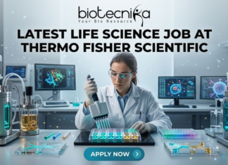 Latest Life Science Job at Thermo Fisher Scientific | Apply Before It Closes Latest Life Science Job at Thermo Fisher Scientific Apply Today. A professional and vibrant featured image for a "Latest Life Science Job at Thermo Fisher Scientific." The image showcases a scientist in a white lab coat and safety goggles, precisely working with a multichannel pipette and a multi-well plate filled with glowing blue and green liquids. The background is a futuristic, high-tech laboratory with advanced bioreactors and computer screens displaying molecular structures. The Biotecnika logo is featured at the top, the main job title is in bold black text in the center, and a sleek teal "APPLY NOW" button is positioned at the bottom.