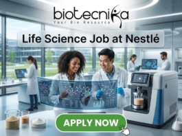 Life Science Job at Nestlé Nutrition Officer Role. A professional featured image titled "Life Science Job at Nestlé". The image showcases the Biotecnika logo at the top and a vibrant green "APPLY NOW" button at the bottom. The background depicts a bright, high-tech laboratory where two scientists—a woman and a man—are smiling and collaborating over a futuristic holographic display of molecular structures. Other researchers and advanced laboratory equipment are visible in the sleek, modern setting.
