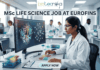 MSc Life Science Job At Eurofins | Apply Before It's Gone. A featured image for a job advertisement titled "MSc LIFE SCIENCE JOB AT EUROFINS." The image depicts a high-tech, modern laboratory setting. In the foreground, a female scientist in a white lab coat is seated at a desk, looking intently at a large computer monitor displaying complex, colorful 3D molecular structures. The lab is bright and clean, featuring various scientific instruments including pipettes, test tubes filled with multi-colored liquids, and high-end analytical machinery in the background where other scientists are also working. At the top center, there is a white rectangular banner with the "biotecnika" logo. Below the main heading, which is written in bold, dark blue letters, there is a prominent, glowing light-blue "APPLY NOW" button at the bottom center. The overall aesthetic is professional, realistic, and sleek.