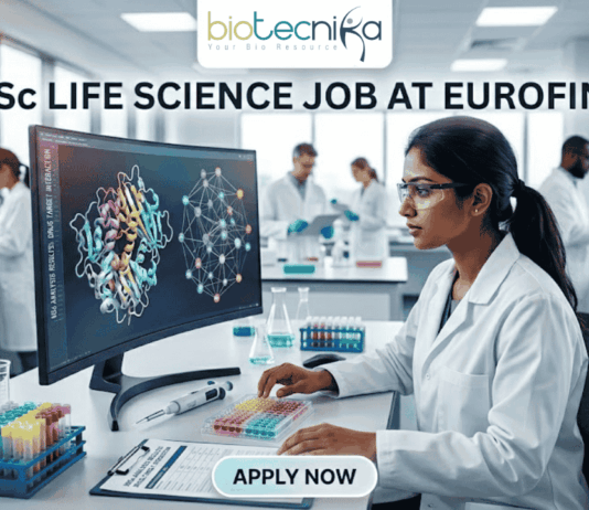 MSc Life Science Job At Eurofins | Apply Before It's Gone. A featured image for a job advertisement titled "MSc LIFE SCIENCE JOB AT EUROFINS." The image depicts a high-tech, modern laboratory setting. In the foreground, a female scientist in a white lab coat is seated at a desk, looking intently at a large computer monitor displaying complex, colorful 3D molecular structures. The lab is bright and clean, featuring various scientific instruments including pipettes, test tubes filled with multi-colored liquids, and high-end analytical machinery in the background where other scientists are also working. At the top center, there is a white rectangular banner with the "biotecnika" logo. Below the main heading, which is written in bold, dark blue letters, there is a prominent, glowing light-blue "APPLY NOW" button at the bottom center. The overall aesthetic is professional, realistic, and sleek.