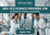MSc Life Science Job Alert Thermo Fisher Scientific is Hiring Freshers! A featured job post graphic with a realistic photo of five diverse scientists collaborating in a modern, well-equipped life science laboratory. At the top of the image, there is a dark green-blue banner featuring the 'biotecnika' logo with the tagline 'Your Bio Resource' in white. Below the logo, large, bold white text reads: 'MSc LIFE SCIENCE FRESHERS JOB at Thermo Fisher Scientific'. The background photo shows the scientists interacting with a futuristic, holographic protein molecule display, with lab equipment like beakers and bioreactors visible. At the bottom center, a distinct dark teal rectangular button has the text 'Apply now' in bold white. The image is 1280x720 pixels and has a professional, engaging design.