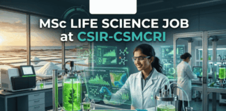 MSc Life Science Job at CSIR-CSMCRI Apply For JRF Role Today!! A unique featured image for "MSc Life Science Job at CSIR-CSMCRI." It depicts a scientist in a specialized lab focusing on marine biotechnology, with bioreactors containing green algae in the foreground and a view of salt pans at sunset through the window. The Biotecnika logo is at the top, and a green "Apply Now" button is at the bottom.