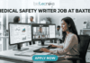 Medical Safety Writer Job at Baxter – High Demand Life Science Role in Ahmedabad! A sleek, realistic featured image for a career opportunity. The Biotecnika logo is at the top. The bold heading "MEDICAL SAFETY WRITER JOB AT BAXTER" spans the upper section. The image depicts a female professional sitting at a clean, modern desk with dual monitors; one screen shows data charts and the other shows a video conference with colleagues. The setting is a bright, contemporary office with a DNA model in the background. A blue and teal gradient "APPLY NOW" button is located at the bottom center.