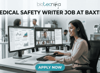 Medical Safety Writer Job at Baxter – High Demand Life Science Role in Ahmedabad! Medical Safety Writer Job at Baxter – High Demand Life Science Role in Ahmedabad! A sleek, realistic featured image for a career opportunity. The Biotecnika logo is at the top. The bold heading "MEDICAL SAFETY WRITER JOB AT BAXTER" spans the upper section. The image depicts a female professional sitting at a clean, modern desk with dual monitors; one screen shows data charts and the other shows a video conference with colleagues. The setting is a bright, contemporary office with a DNA model in the background. A blue and teal gradient "APPLY NOW" button is located at the bottom center.