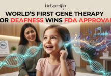 NEWS World’s First Gene Therapy for Deafness Wins FDA Approval. An emotionally powerful, 1280x720 featured image for a news article titled "WORLD’S FIRST GENE THERAPY FOR DEAFNESS WINS FDA APPROVAL." At the top center sits the black Biotecnika logo. The central focus is a young girl with an expression of pure joy and wonder, touching her ear as a glowing, ethereal DNA double helix transforms into vibrant, colorful musical notes and sound waves flowing toward her. In the soft-focus background, a mother watches with tears of happiness, and an FDA certificate is visible on a desk. The overall scene blends medical breakthrough with human emotion in a warm, clinical yet hopeful setting.