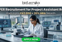 NIPER Recruitment for Project Assistant Role | Earn Upto ₹42,000 + 20% HRA/Month – Apply Now! NIPER Recruitment for Project Assistant Role | Earn Upto ₹42,000. A scientist using an automated liquid handling system in a modern research facility. Header: "NIPER Recruitment for Project Assistant Role" with the HRA salary tagline. Biotecnika logo at top, green "Apply Now" button.
