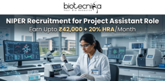 NIPER Recruitment for Project Assistant Role | Earn Upto ₹42,000. A scientist using an automated liquid handling system in a modern research facility. Header: "NIPER Recruitment for Project Assistant Role" with the HRA salary tagline. Biotecnika logo at top, green "Apply Now" button.