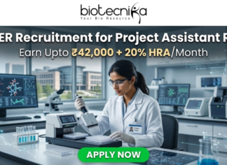 NIPER Recruitment for Project Assistant Role | Earn Upto ₹42,000 + 20% HRA/Month – Apply Now! NIPER Recruitment for Project Assistant Role | Earn Upto ₹42,000. A scientist using an automated liquid handling system in a modern research facility. Header: "NIPER Recruitment for Project Assistant Role" with the HRA salary tagline. Biotecnika logo at top, green "Apply Now" button.